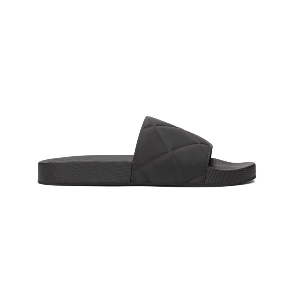 Bottega Veneta black rubber slides.